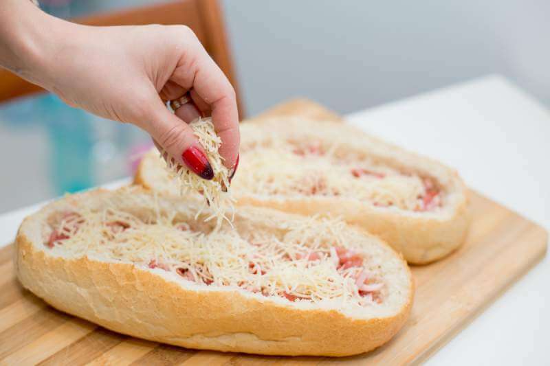 pizza-with-a-hand-that-sprinkle-parmesan