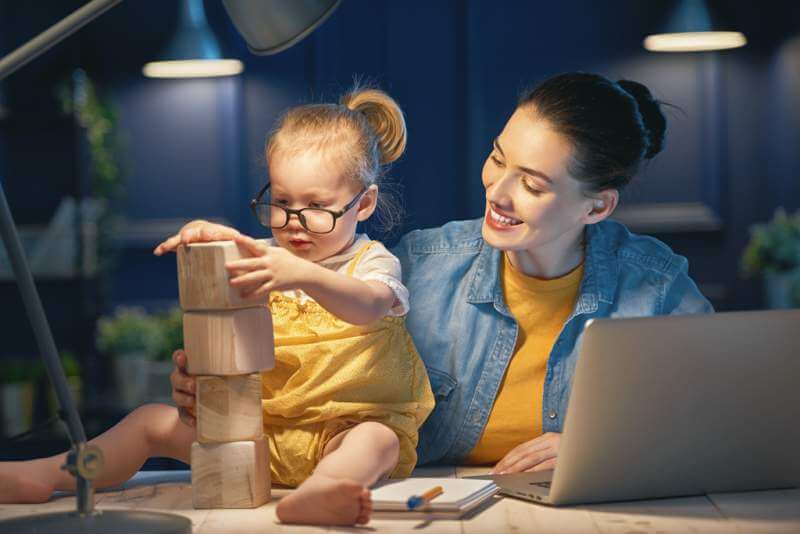 mother with toddler working