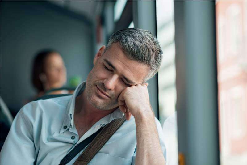 man-sleeping-on-the-bus