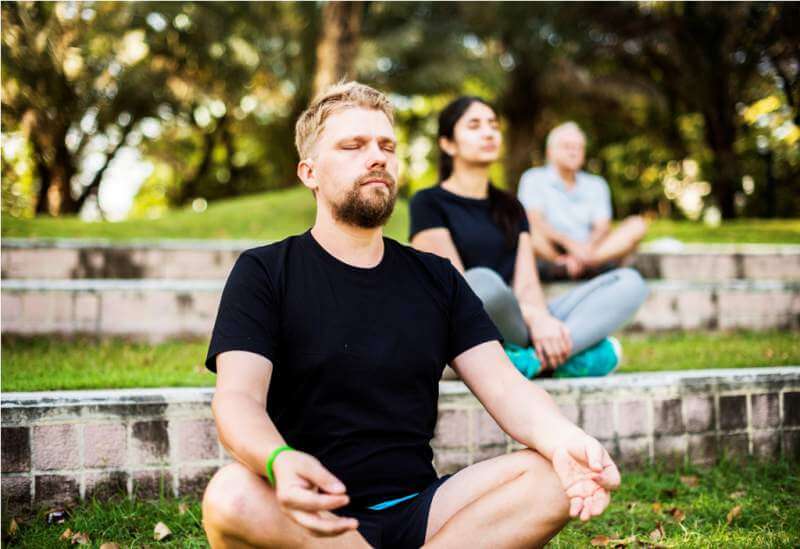 people-doing-yoga-at-the-park