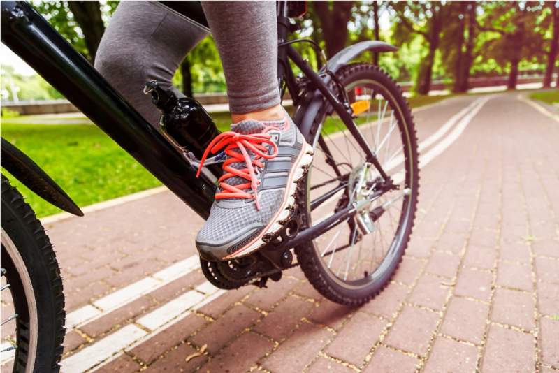 close-up-image-of-cyclist-man-feet-riding