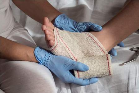 close-up-of-a-nurse-tying-bandage-on-patients