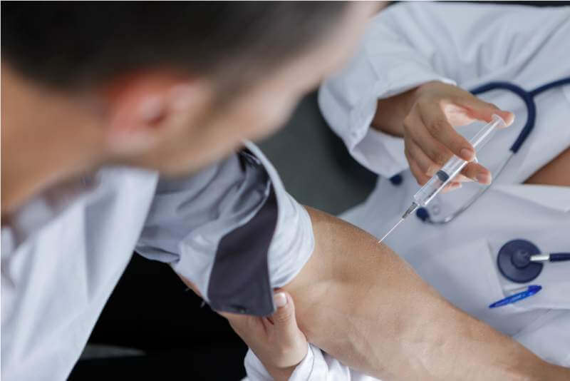 doctor-injection-flu-vaccine-to-patients-arm