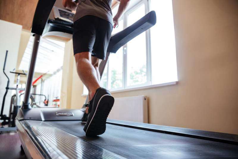 legs-of-young-man-athlete-running-on-treadmill