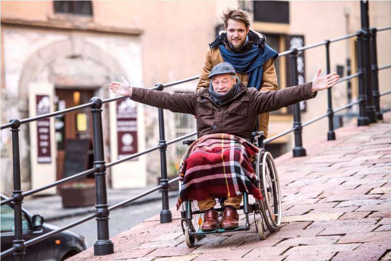 senior-father-in-wheelchair-and-young-son