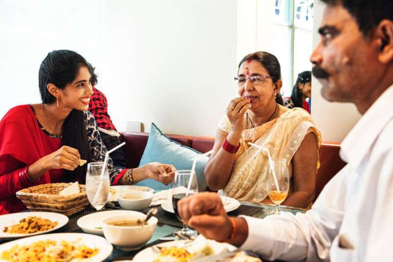 family-having-indian-food