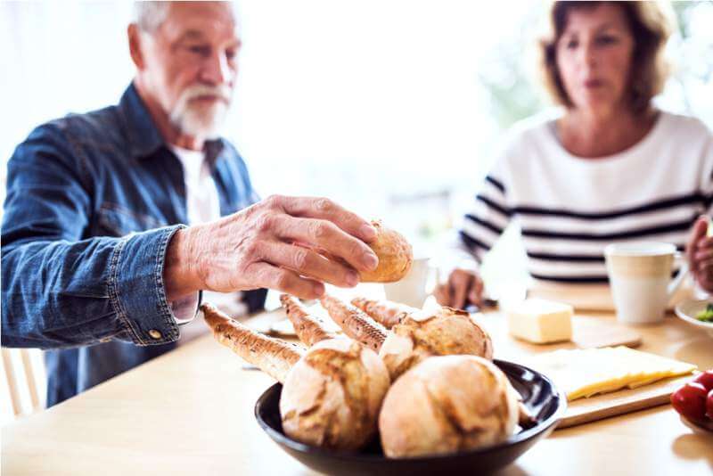 senior-couple-eating-breakfast-at-home