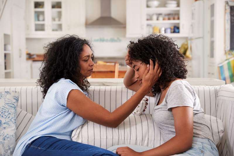 mother-talking-with-unhappy-teenage-daughter