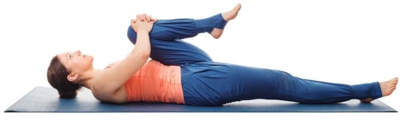 woman-doing-hatha-yoga-asana-ardha-pawanmuktasan