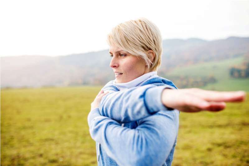 young-blond-runner-outside-in-sunny-nature