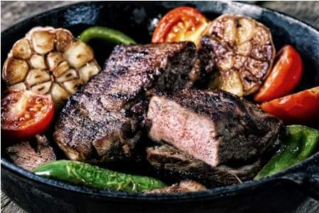 appetizing-beef-steak-in-frying-pan