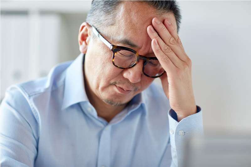 businessman-suffering-from-headache-at-office