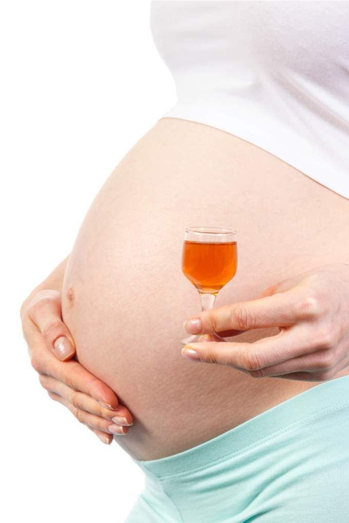 woman-in-pregnant-with-glass-of-wine-concept