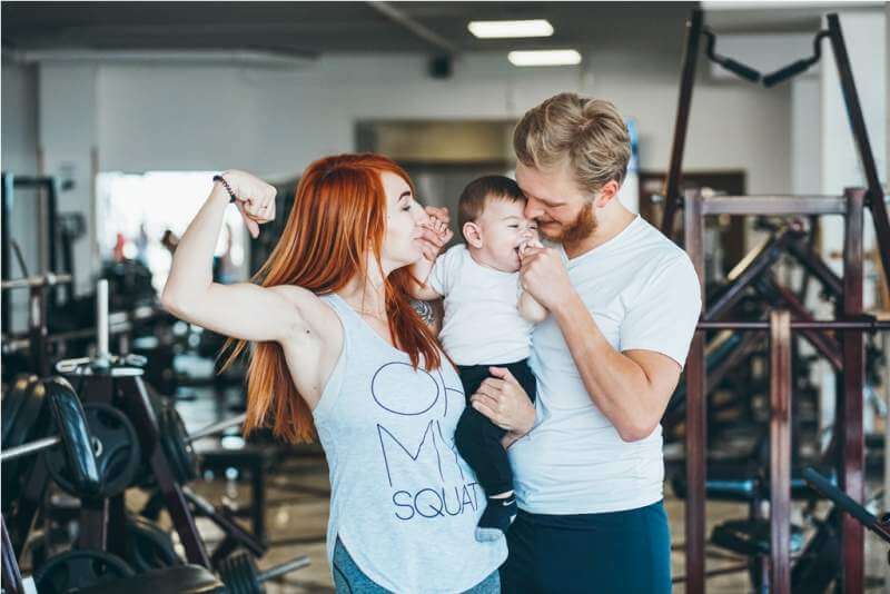 young-family-with-little-boy-in-the-gym