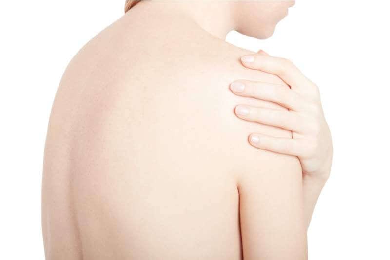 young-woman-touching-her-painful-shoulder