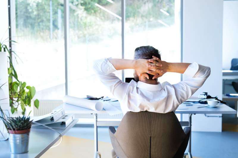 businessman-at-the-desk-in-his-office