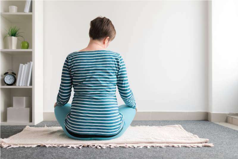 pregnant-woman-practicing-yoga-exercise-at-home