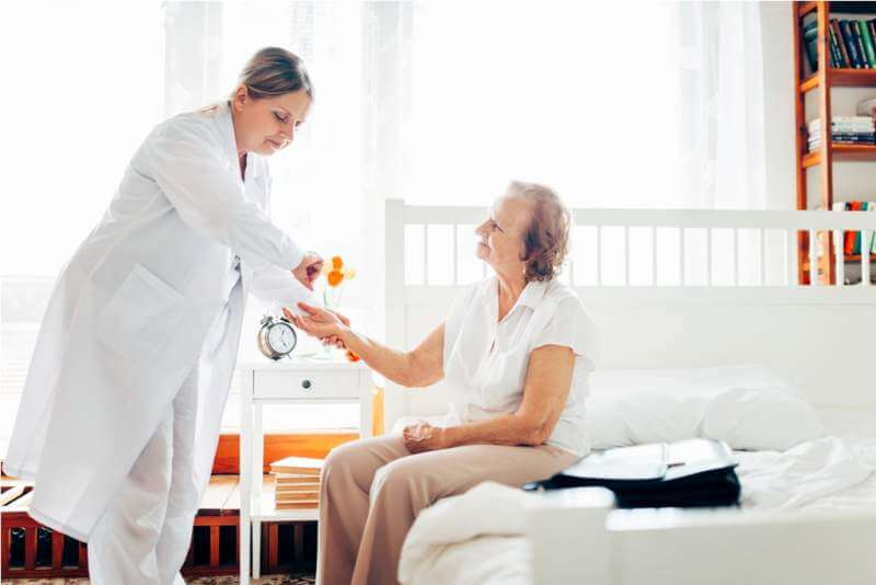 providing-care-for-elderly-doctor-visiting