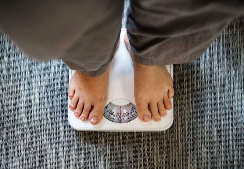 woman-standing-on-a-scale