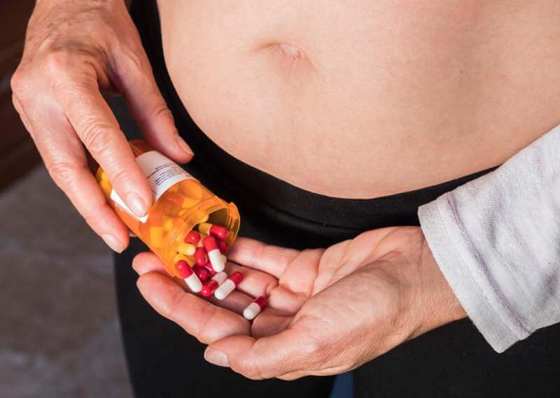 woman-with-overweight-takes-medication