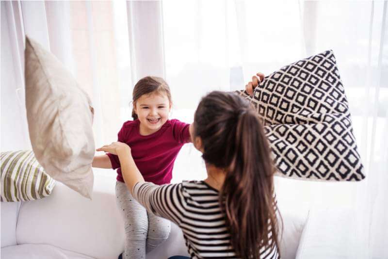 young-mother-with-a-small-girl-at-home-having