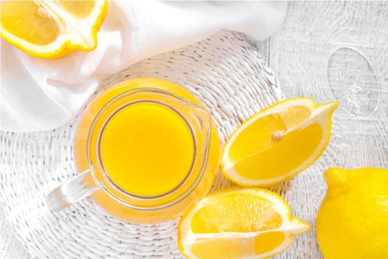 lemon-juice-in-glass-jug-and-fresh-fruits