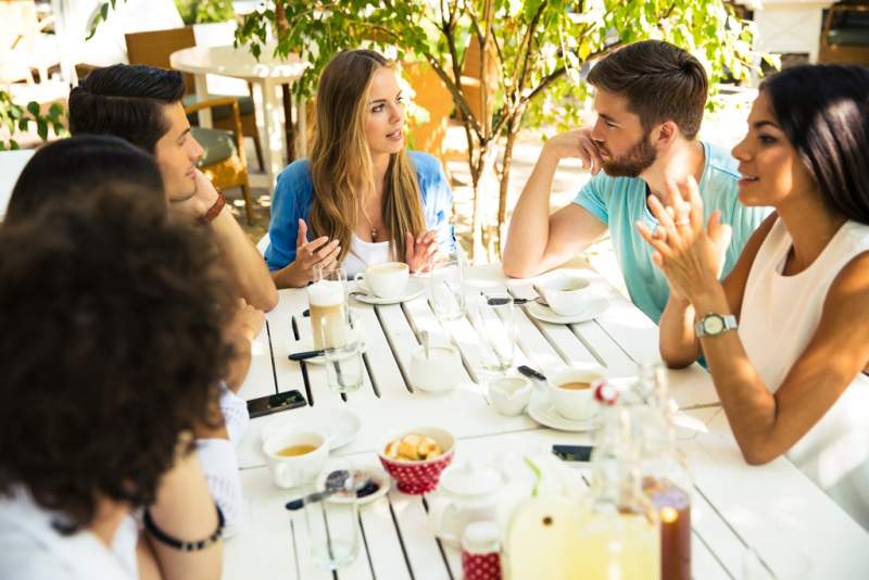 friends-enjoying-meal-in-restaurant