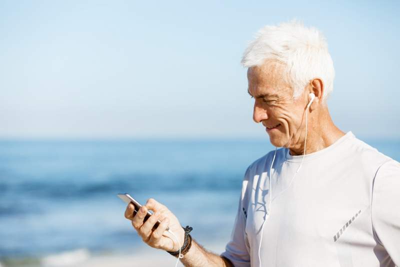 male-runner-with-his-mobile-smart-phone-standing