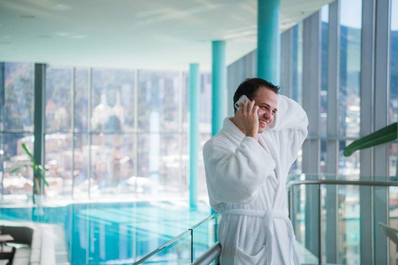 man-use-the-cellphone-at-luxury-hotel-spa