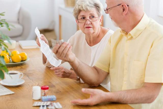 senior-woman-reading-leaflet-of-a-drug