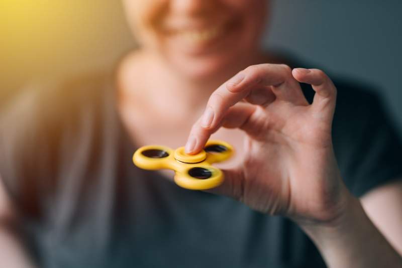 woman-playing-with-fidget-spinner