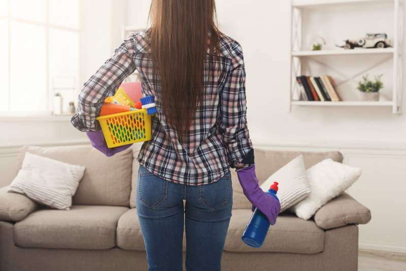 woman-with-cleaning-equipment-ready-to-clean-room