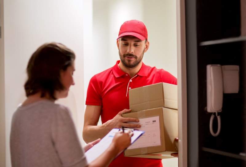 deliveryman-and-customer-with-parcel-boxes