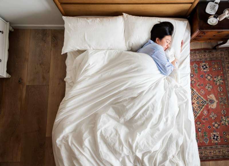 asian-woman-on-the-bed-sleeping-by-herself