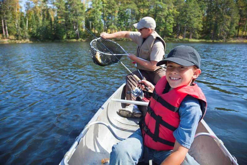 boy-and-father-fishing-in-a-canoe