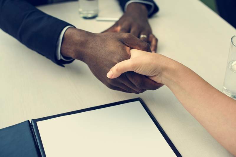 business-contract-documents-handshake-concept