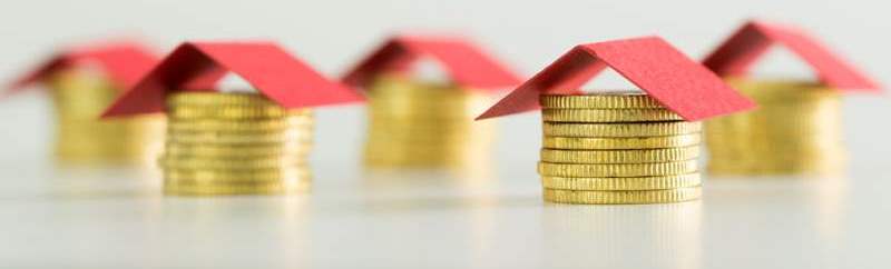 houses-made-from-coins-and-red-color-roof