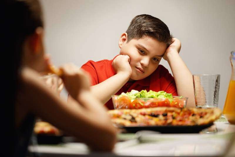 mother-giving-salad-instead-of-pizza