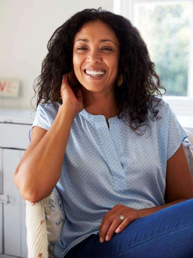 portrait-of-woman-sitting-in-chair-at-home