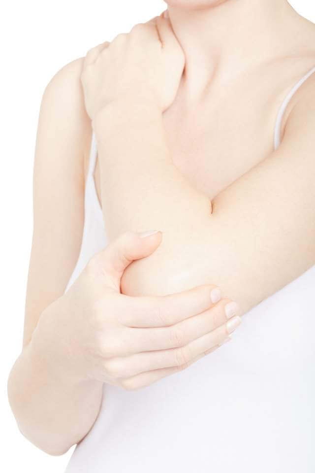 woman-holding-elbow-and-shoulder-in-pain-isolated