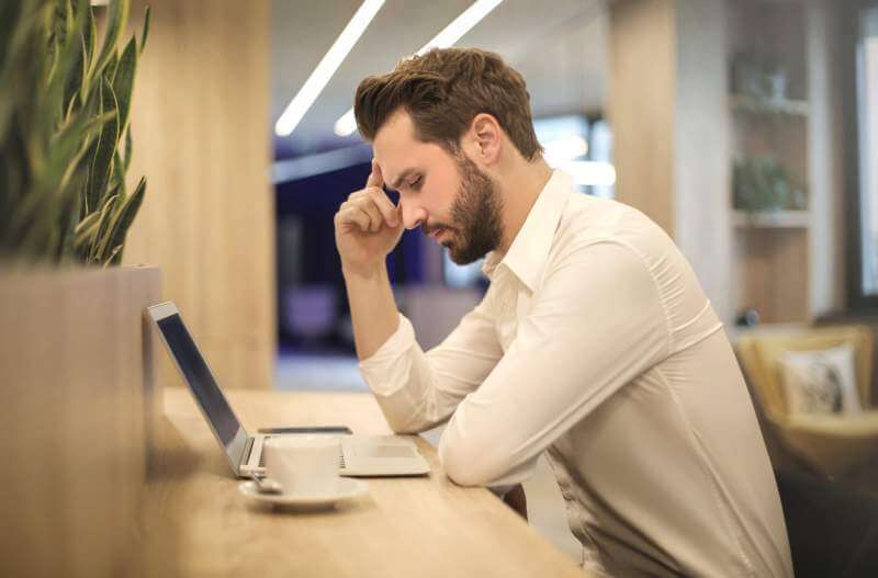 men using laptop stress