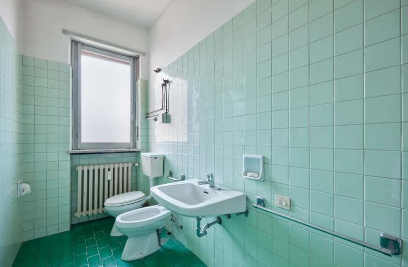 old-bathroom-interior-with-green-tiles