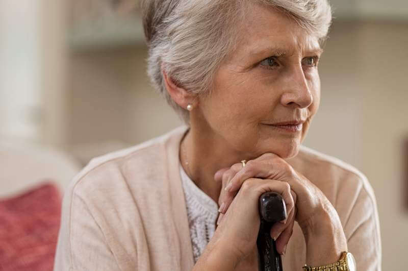 senior-woman-holding-cane