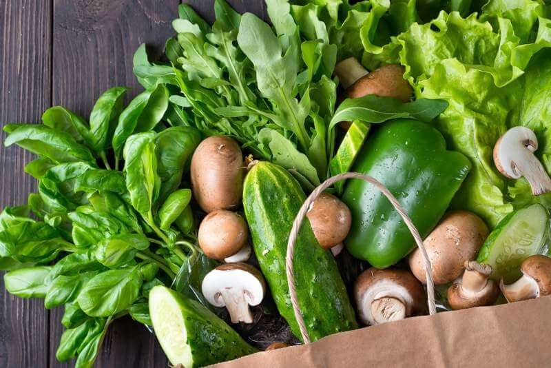 close-up-of-green-vegetables-on-wooden