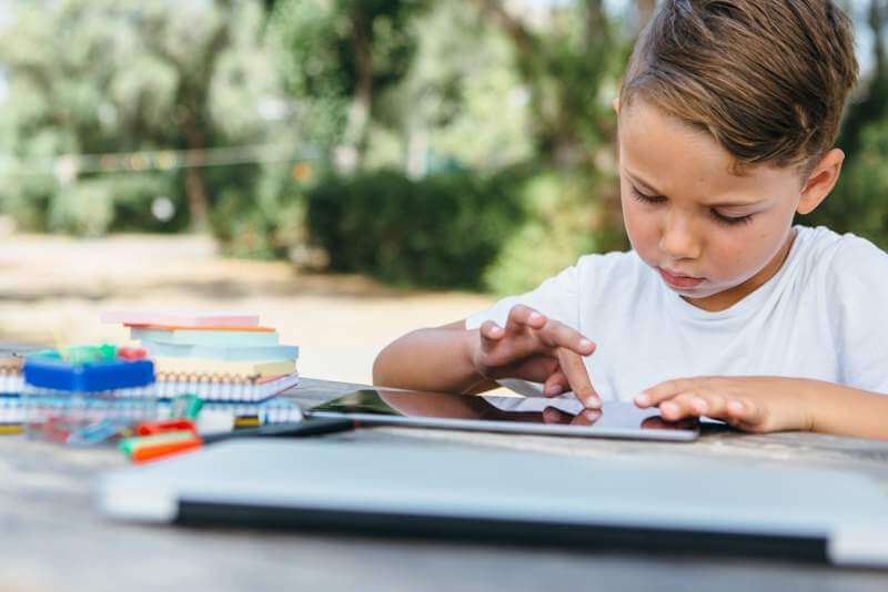 kid-browsing-tablet-doing-homework