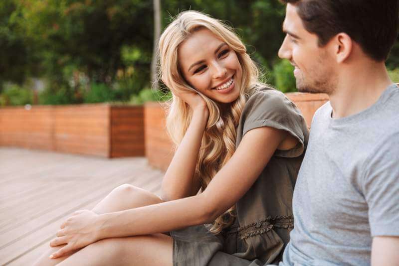 smiling-lovely-young-couple-talking-and-looking