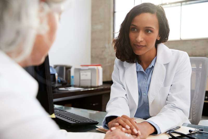 young-female-doctor-in-consultation-with-senior