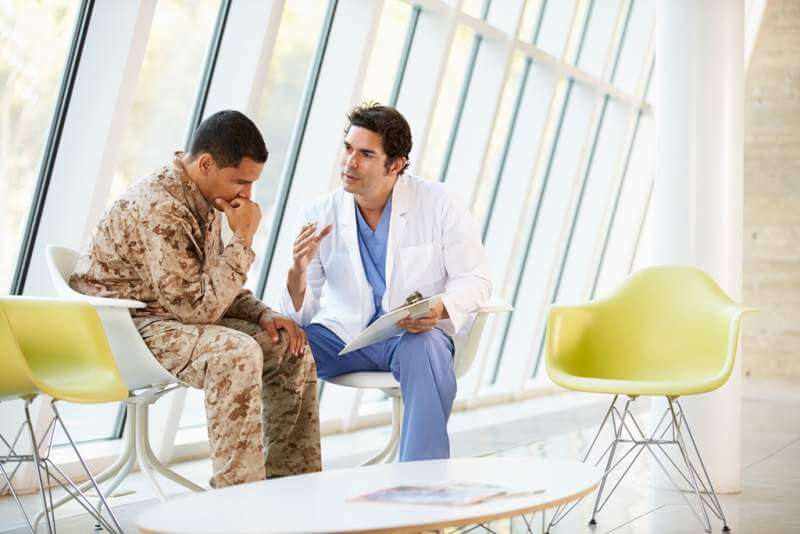 doctor-counselling-soldier-suffering-from-stress