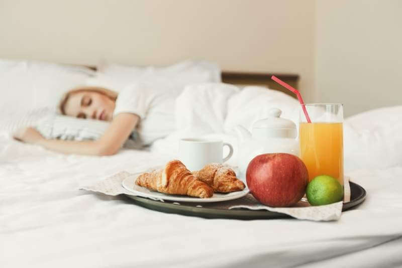 closeup-of-breakfast-in-front-of-sleeping-woman