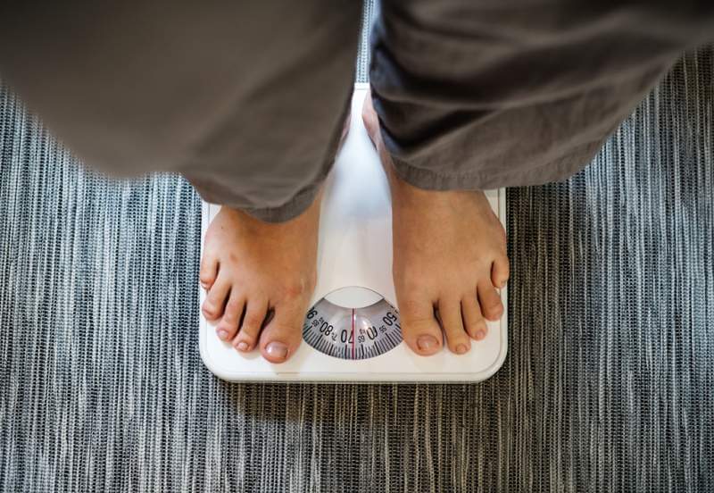 woman-standing-on-a-scale